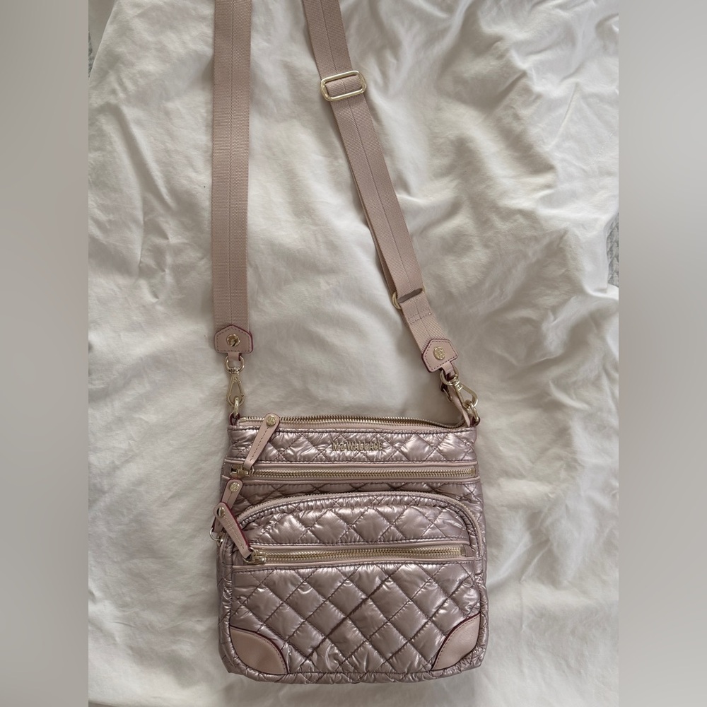 MZ Wallace Downtown Crosby crossbody bag in a rose gold metallic quilted nylon.